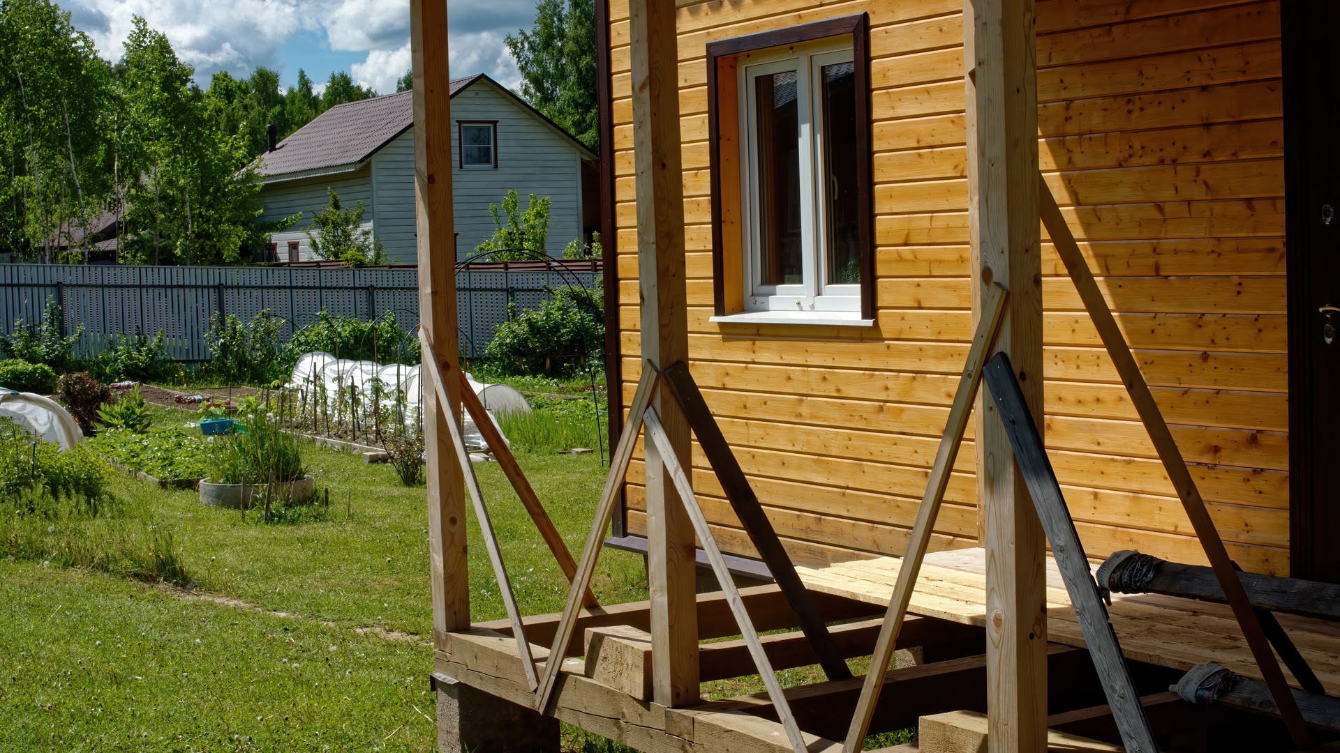 construction of wooden extensions of a rural house, russia